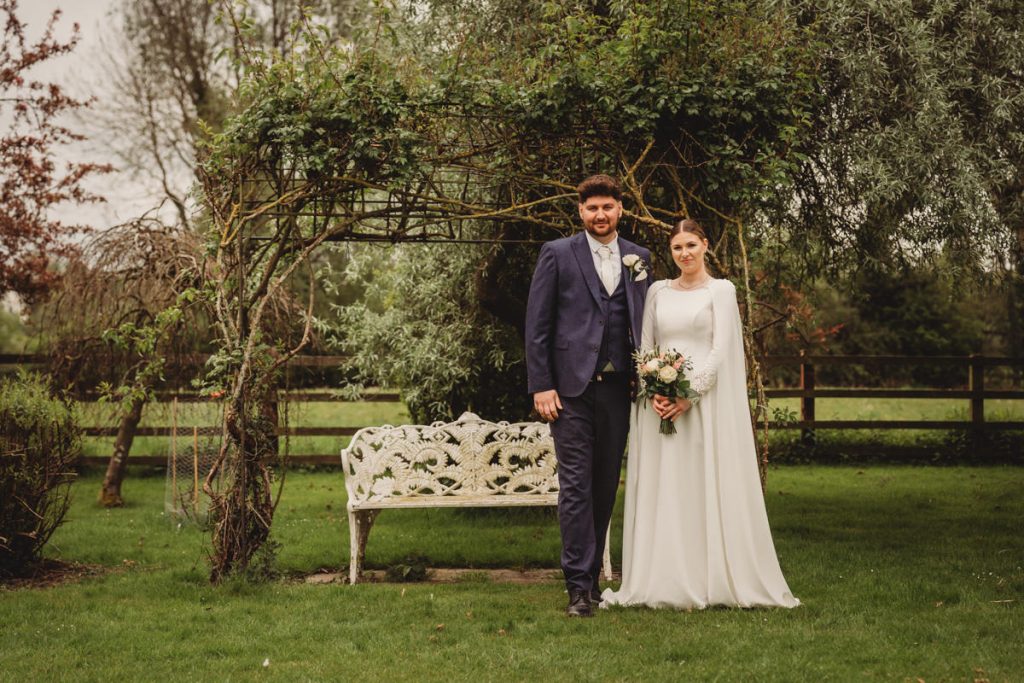 Bride and groom in garden setting