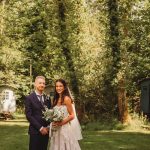 Bride and groom in woodland wedding setting