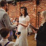 Wedding ceremony with couple exchanging rings