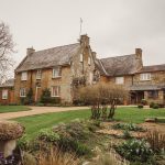 Historic stone country house with landscaped garden