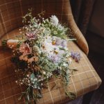 Floral bouquet on checked chair