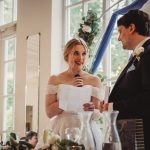 Bride gives speech during wedding reception.