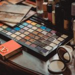 Variety of makeup products on a dressing table