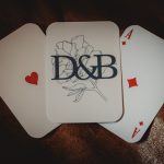 Three playing cards: Ace heart, D&B, Ace diamond.