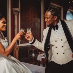 Bride and groom toasting with champagne glasses