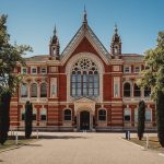 Historic red-brick building with ornate architecture.