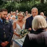 Outdoor wedding ceremony with bride and groom