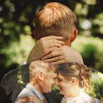 Wedding couple embracing in nature, double exposure effect.