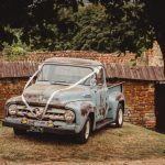 Rustic blue vintage truck with wedding ribbons