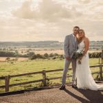 Bride and groom in countryside wedding setting