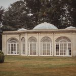 Elegant conservatory in lush garden setting