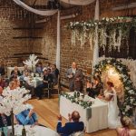 Wedding reception speech in rustic venue