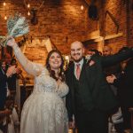 Happy couple celebrates wedding ceremony.