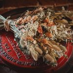 Rustic bouquet lying on a vintage red barrel.