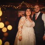 Couple celebrating their wedding day with lights.