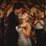 Bride and groom sharing first dance at wedding.