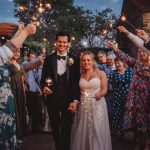 Bride and groom with sparklers at wedding celebration