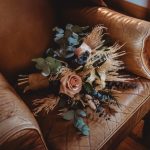 Floral bouquet on a vintage leather armchair