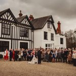 Group photo in front of English manor house.