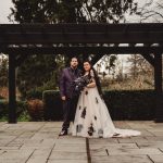 Couple in garden pavilion, wedding attire