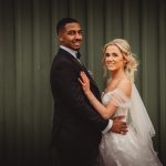 Bride and groom smiling on their wedding day.