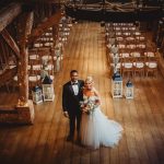 Bride and groom in rustic wedding venue