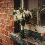 Rustic bouquet on weathered brick windowsill