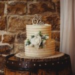 Elegant wedding cake with floral decoration.