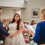 Wedding ceremony with couple and officiant.