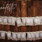 Organic confetti bags on wooden display with pegs.