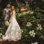 Bride and groom in a garden setting