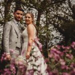 Bride and groom in a floral setting