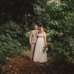 Bride and groom in forest wedding portrait