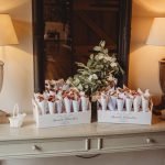 Petal cones and lamps on a wooden table.