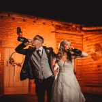 Couple drinking champagne at wedding celebration.