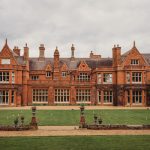 Historic red-brick manor house with gardens