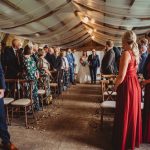 Bride walking down aisle at wedding ceremony