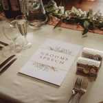 Wedding table setting with groom's speech card.