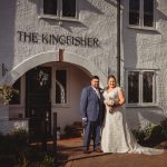 Bride and groom outside The Kingfisher building.