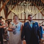 Bride and groom walking down the aisle