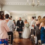 Bride and groom walking down the aisle