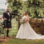 Bride and groom in garden wedding attire