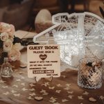 Wedding table with guest book and flowers.