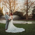 Bride and groom in winter garden setting