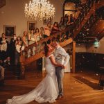 Bride and groom dancing at wedding reception.