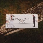 Wedding invitation on rustic wooden surface