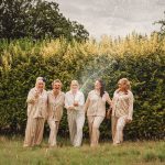 Women celebrating with champagne outdoors