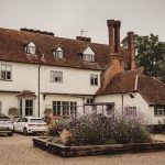 Rustic country house with parked cars