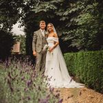 Bride and groom in garden, wedding photo