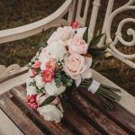 Bouquet of roses on a rustic bench